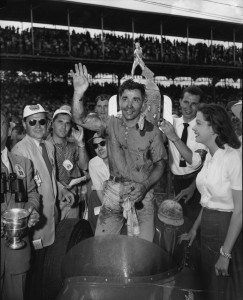 Bill Vukovich waves a victory salute