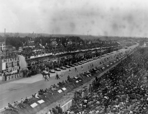 Drivers race for their cars at the start of the Le Mans 24-hour Race