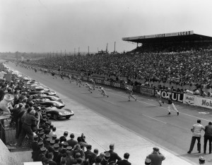 Drivers dash for their sports cars to start the Le Mans, France, 24-hour endurance race