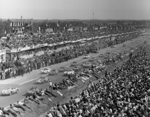 Fifty-five sleek race cars roar away in the classic start of the Le Mans 24-hour endurance race