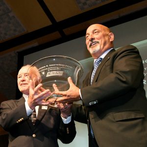 J.C. Argetsinger (left) presents driver Bobby Rahal (right) with the Argetsinger Award on June 27, 2019.